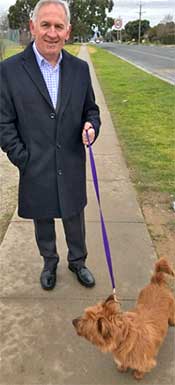 Mr Lucas walking with Rusty, who was handed into the Albury Wodonga Animal Rescue centre.