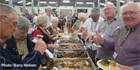 Retreat caravan owners tuck into a buffet at their recent rally on the Fraser Coast